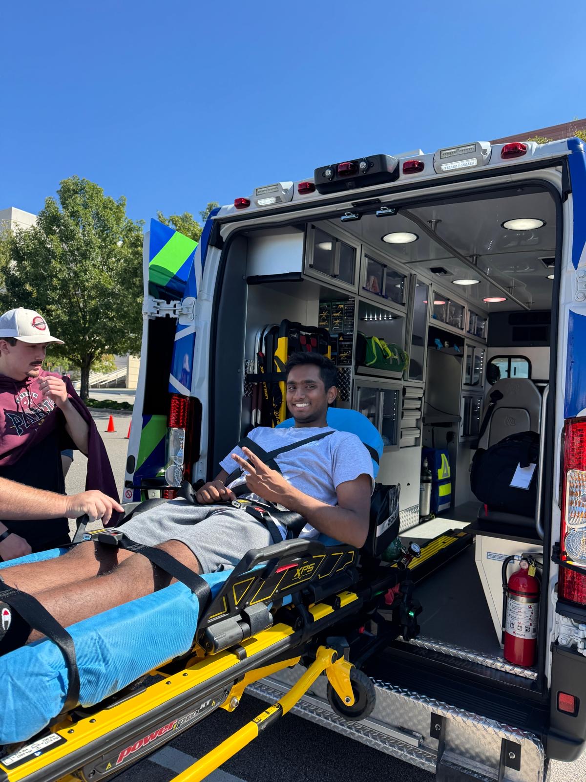 Gamecock EMS member learning ambulance stretcher operations